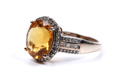 Lot 57 - A fire opal and diamond cluster ring
