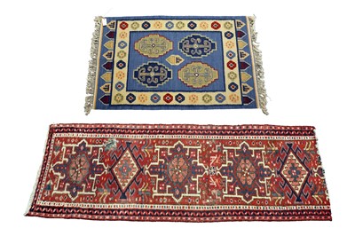 Lot 156 - A Kilim style rug; and a Caucasian runner