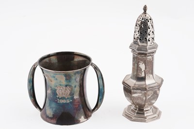 Lot 100 - A silver octagonal caster; and a silver two handheld christening cup