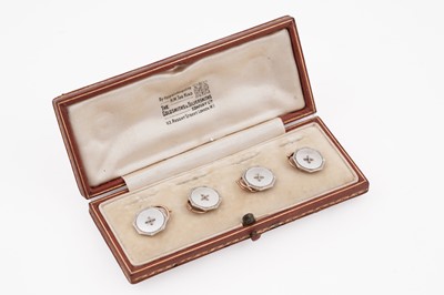 Lot 9 - A set of four 18ct yellow gold and mother of pearl button studs