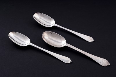 Lot 494 - A pair of Queen Anne silver wavy-end spoons; and a William III silver trefid spoon