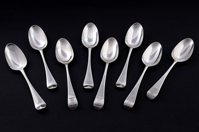 Lot 498 - A set of four early George III silver tablespoons; and a set of four Hanoverian silver tablespoons