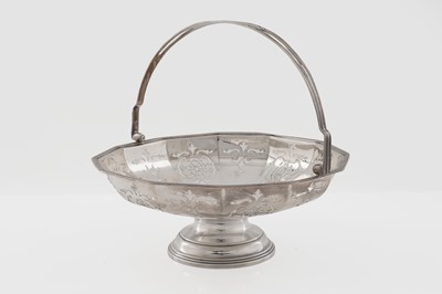 Lot 6 - A George V silver swing handles basket