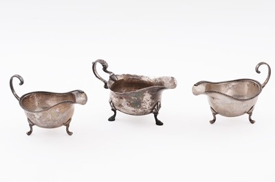 Lot 120 - A pair of George VI small silver sauceboats