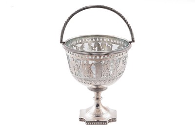Lot 121 - A Victorian engraved silver sugar basket