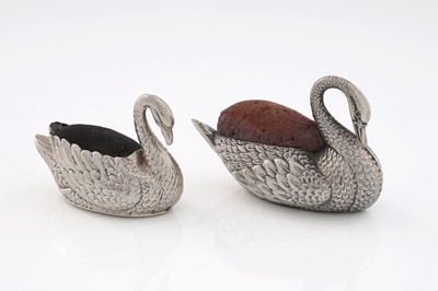 Lot 325 - An Edwardian novelty silver pin cushion; and another similar smaller example