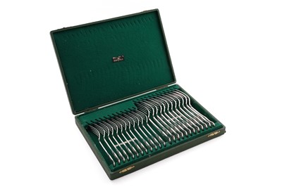 Lot 234 - George V eleven silver table forks and twelve silver dessert forks; and a later silver table fork