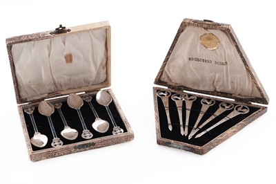 Lot 238 - A cased set of six silver and enamel coffee spoons; and a cased set of six silver cocktail sticks