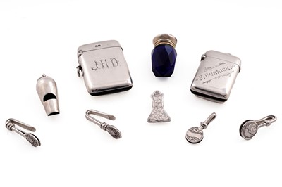 Lot 334 - A small collection of five small silver napkin clips; a late Victorian silver vesta case; and others