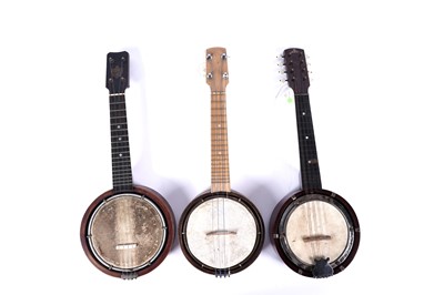 Lot 66 - Two ukulele banjos; and a mandolin banjo