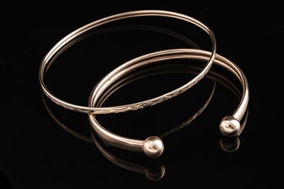 Lot 23 - Two 9ct yellow gold bangles