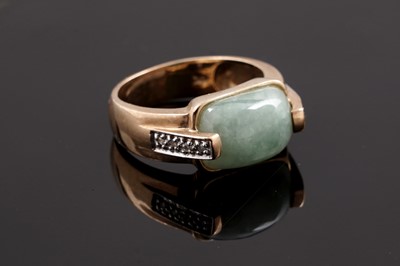 Lot 28 - A jade coloured stone and diamond ring