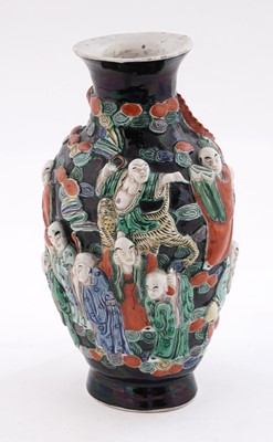 Lot 319 - A Chinese famille noir biscuit vase