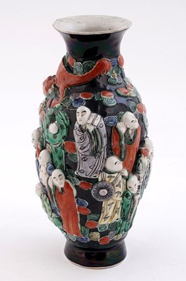 Lot 319 - A Chinese famille noir biscuit vase