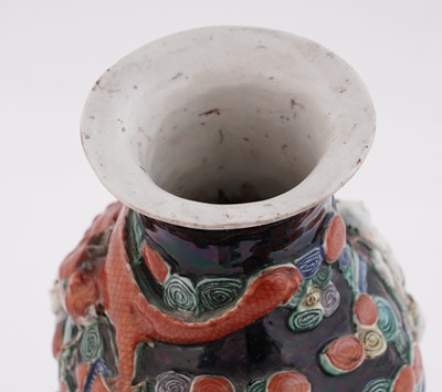 Lot 319 - A Chinese famille noir biscuit vase