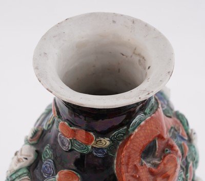 Lot 319 - A Chinese famille noir biscuit vase