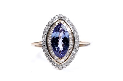 Lot 16 - A tanzanite and diamond cluster ring