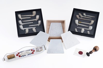 Lot 653 - A collection of clay pipes, presented in framed mounts; and other items