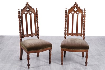 Lot 24 - A pair of early 20th Century oak ecclesiastical hall chairs