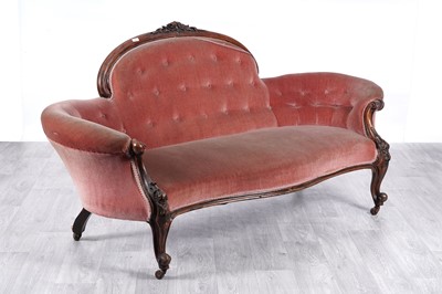 Lot 10 - A Victorian walnut serpentine-fronted, button back sofa