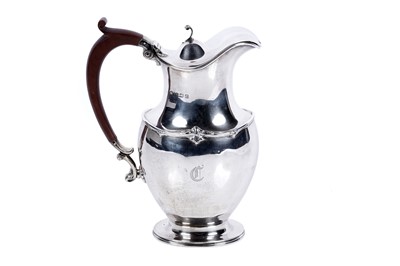 Lot 115 - A George V silver hot water jug, by Adie Bros,...