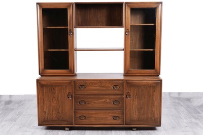 Lot 111 - Ercol: an elm ‘Windsor’ display cabinet