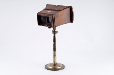 Lot 645 - A walnut stereo viewer on adjustable stand