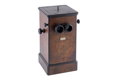 Lot 646 - A walnut pedestal stereo viewer