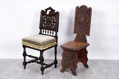 Lot 5 - Two carved oak hall chairs