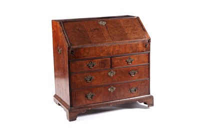 Lot 597 - A George II walnut bureau