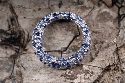 Lot 937 - A sapphire and diamond pendant