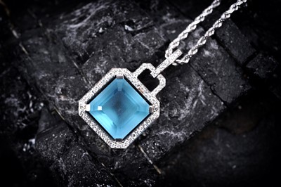 Lot 940 - A topaz and diamond pendant
