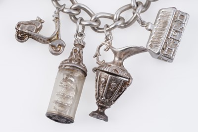 Lot 110 - A silver curb-link novelty charm bracelet