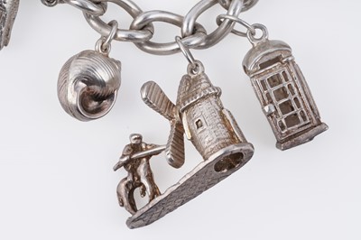 Lot 110 - A silver curb-link novelty charm bracelet