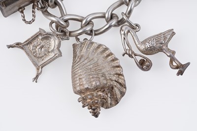 Lot 110 - A silver curb-link novelty charm bracelet