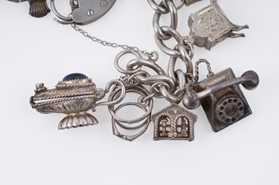 Lot 110 - A silver curb-link novelty charm bracelet