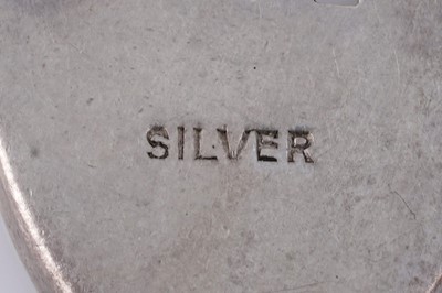 Lot 110 - A silver curb-link novelty charm bracelet