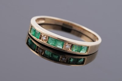 Lot 104 - A modern French emerald and diamond ring
