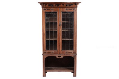 Lot 557 - Manner of Maple & Co for Liberty & Co Ltd London: an Edwardian oak arts and crafts bookcase