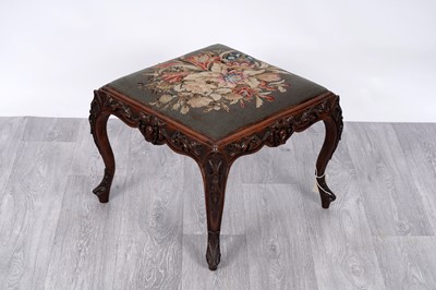 Lot 6 - A Victorian carved walnut stool