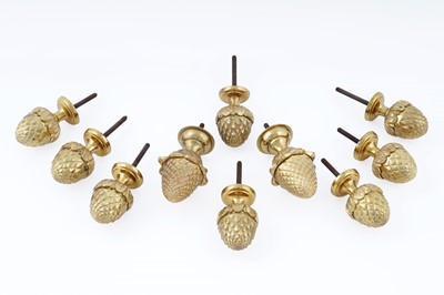 Lot 199 - A collection of eight small and two large gilt metal pineapple finials