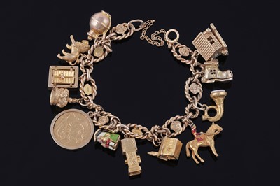 Lot 38 - An early 20th Century 9ct gold charm bracelet