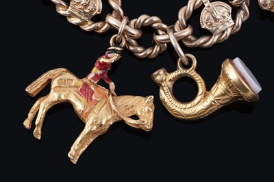 Lot 38 - An early 20th Century 9ct gold charm bracelet