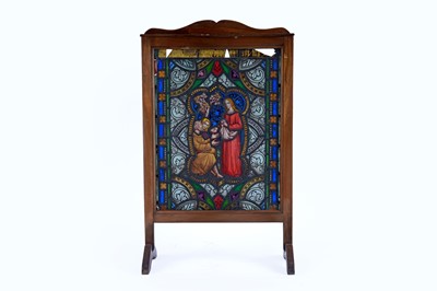 Lot 209 - An early 20th Century mahogany and stained-glass fire screen