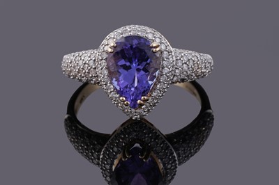 Lot 101 - A contemporary tanzanite and diamond ring