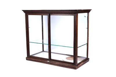 Lot 744 - An Edwardian glazed mahogany shop display cabinet