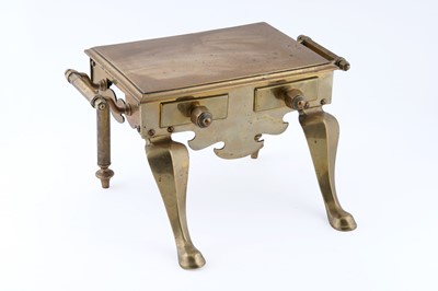 Lot 211 - A Georgian brass footman