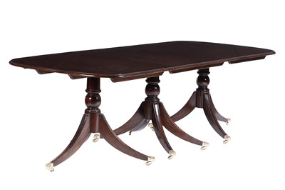 Lot 599 - A mahogany Regency style three pillar dining table
