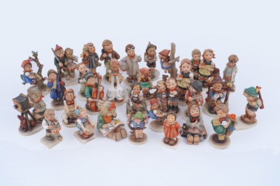 Lot 379 - A collection of thirty Hummel/Goebbel ceramics figures and figure groups