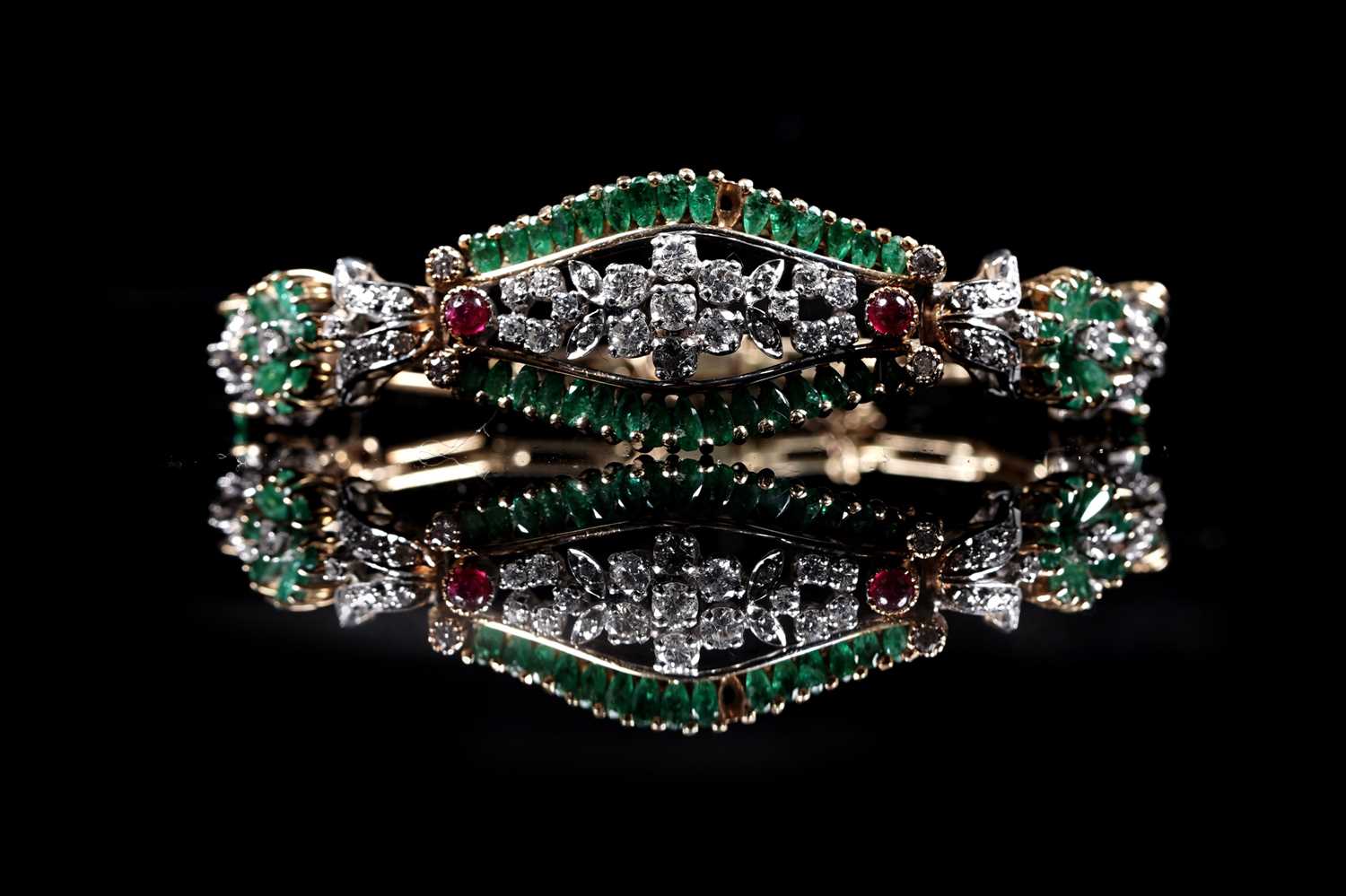Lot 921 - An emerald, ruby and diamond bracelet